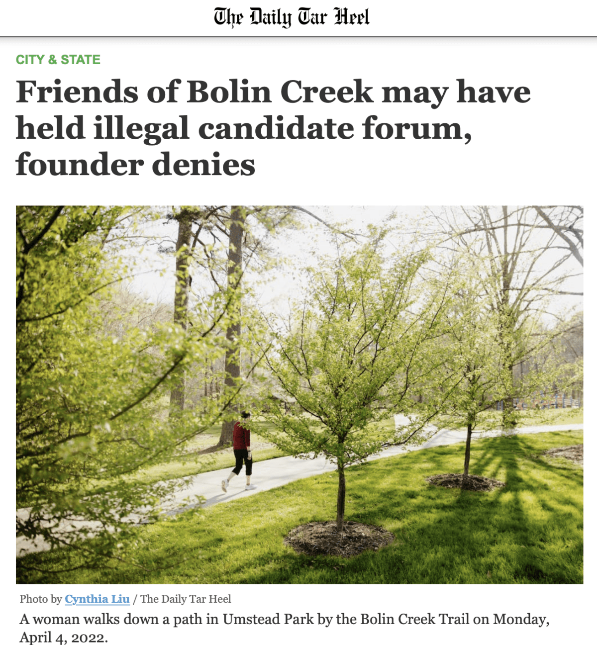 Screenshot of Daily Tar Heel article with the headline "Friends of Bolin Creek may have held illegal candidate forum, founder denies." Unearth the headline is a photo of a person running in Umstead Park.